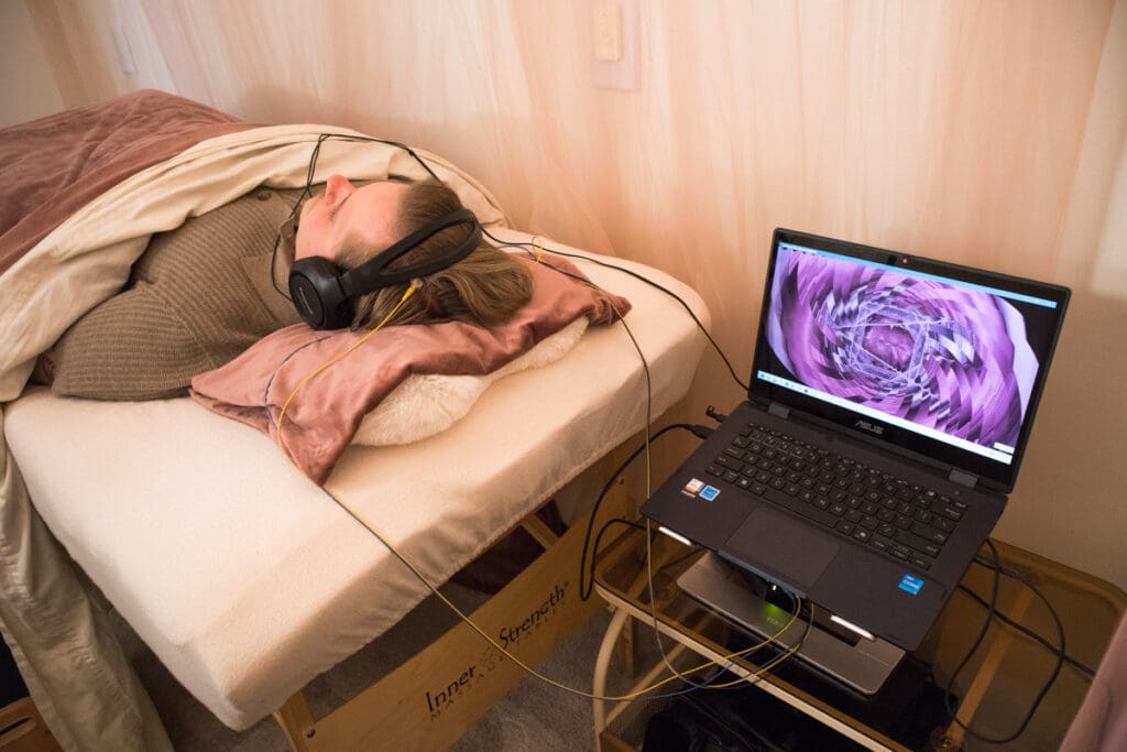 A client engaged in NeurOptimal® neurofeedback at PORTAL Therapy.