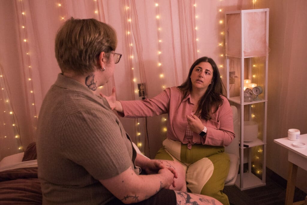Elise Kindya and a client engaged in psychotherapy and NeurOptimal® neurofeedback.